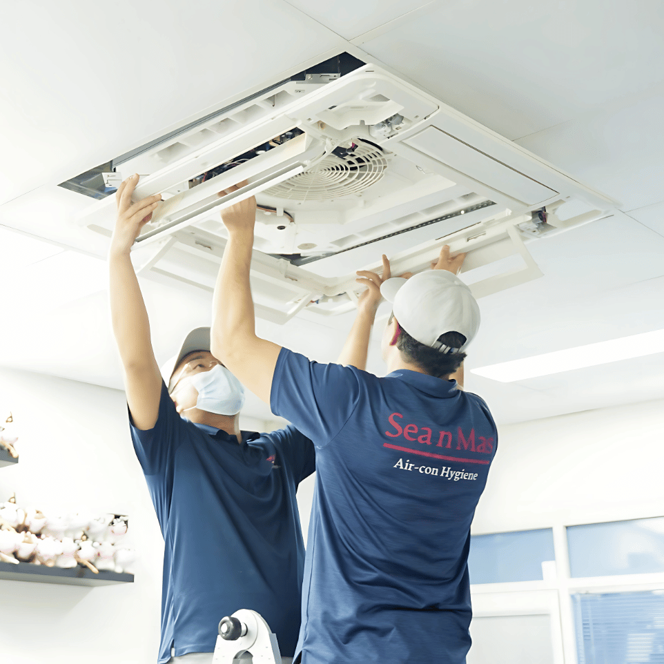 Sea n Mas technician cleaning a ceiling cassette aircon
