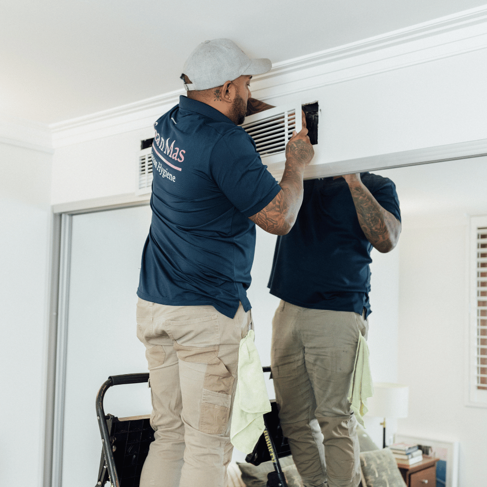 Sea n Mas technician cleaning a ceiling cassette aircon